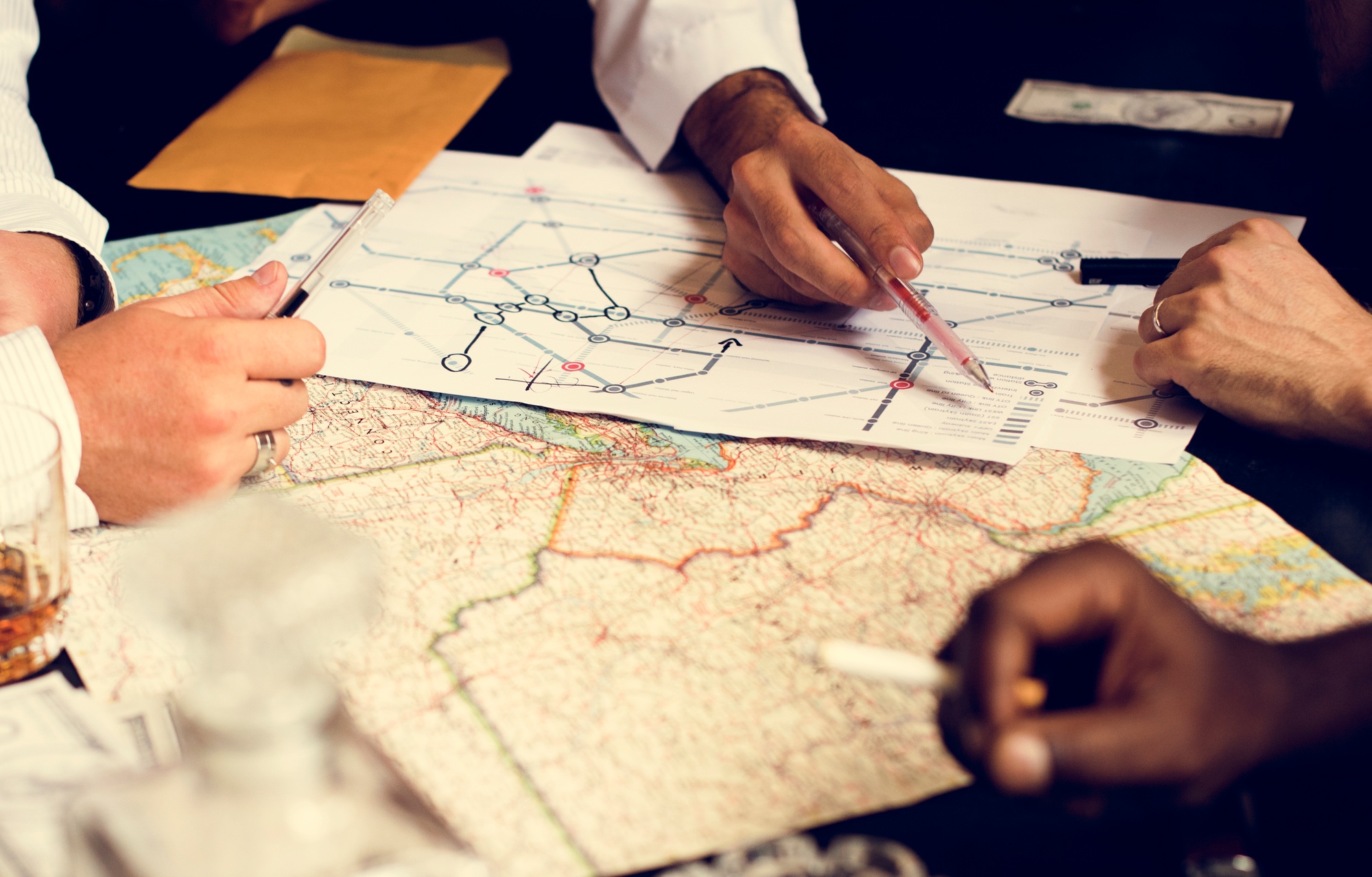 Group of people planning with the map